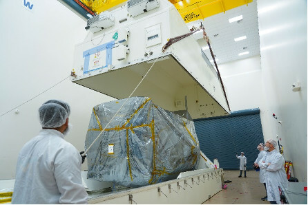 Technicians place the transportation container cover on OSAM-1 shortly before it departed for Goddard Space Flight Center.